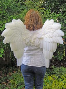 Downswept white feather angel wings back view